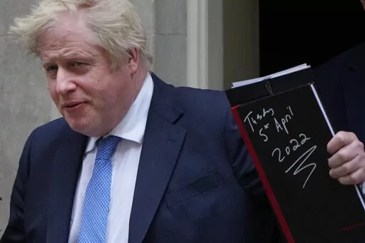 Britain's Prime Minister Boris Johnson waves to the media as he leaves 10 Downing Street for the House of Commons to make a statement about Downing Street parties during the coronavirus lockdowns in London, Tuesday, April 19, 2022. (AP Photo/Alastair Grant)