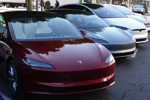 Tesla vehicles are displayed at the AutoMobility LA Auto Show, Thursday, Nov. 21, 2024, in Los Angeles. (AP Photo/Damian Dovarganes, File)