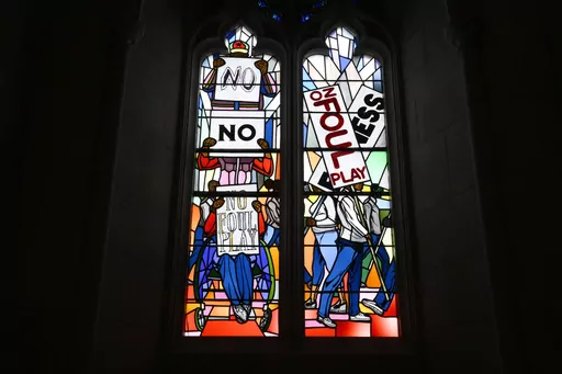 Light shines through new stained-glass windows with a theme of racial justice during an unveiling and dedication ceremony at the Washington National Cathedral for the windows on Saturday, Sept. 23, 2023, in Washington. The windows fill the space that had once held windows honoring Confederate Gens. Robert E. Lee and Stonewall Jackson. The new windows depict a march for justice by African Americans. (AP Photo/Nick Wass)