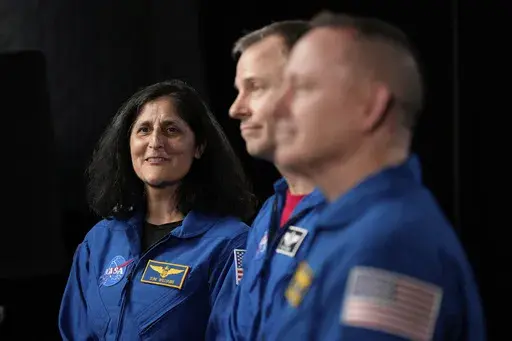Astronauts Suni Williams, from left, Nick Hague, and Butch Wilmore are interviewed at Johnson Space Center on Monday, March 31, 2025, in Houston. (AP Photo/Ashley Landis)