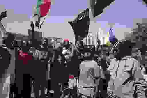 People chant slogans during a anti-coup protests that have rocked the country since a military coup three months ago.in Khartoum, Sudan, Sunday, Jan. 30, 2022. (AP Photo/Marwan Ali)