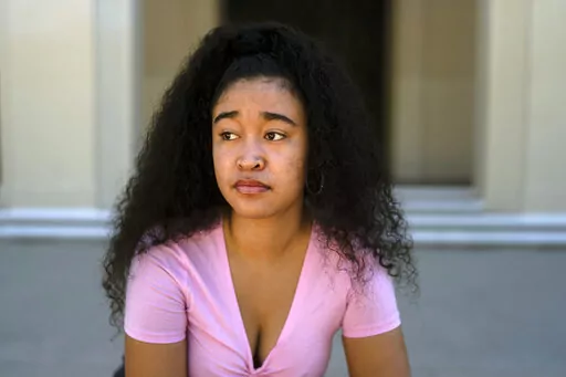 Marina Aina, a 21-year-old student majoring in American Studies at Pomona College, poses for photos on the school's campus in Claremont, Calif., Thursday, Sept. 22, 2022. Aina was used to getting paid for her internships and could not see taking an unpaid opportunity over a summer job. "If I felt that it wasn't compensated then I wouldn't go for it because I wouldn't have the funds to cover it," Aina says. "I wouldn't want to ask my parents, who are helping me pay for college, to pay for somethi