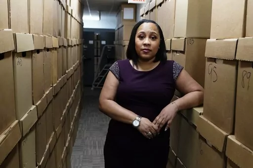 Fulton County District Attorney Fani Willis poses for a photo at her office, Feb. 24, 2021 in Atlanta. Willis is opposing a new Georgia bill that passed the House Monday, March 27, 2023, that would create a commission to discipline and remove elected prosecutors, saying it unfairly targets minority Democrats. (AP Photo/John Bazemore, File)