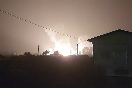 In am image taken from video, flames and smoke rise from a military airbase Wednesday, Oct. 5, 2022, in Gangnueng, South Korea. South Korea’s Joint Chiefs of Staff said no injuries were reported from the explosion which involved a short-range Hyumoo-2 missile. (Kim Hee Soo via AP)
