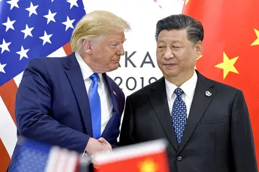President Donald Trump, left, shakes hands with China's President Xi Jinping during a meeting on the sidelines of the G-20 summit in Osaka, Japan, June 29, 2019. (AP Photo/Susan Walsh, File)