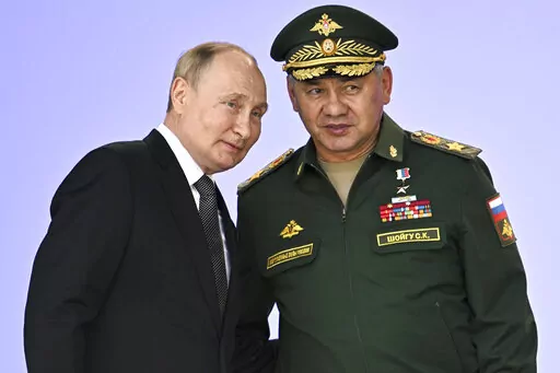 FILE Russia's President Vladimir Putin and Russian Defense Minister Sergei Shoigu attend the opening of the Army 2022 International Military and Technical Forum in the Patriot Park outside Moscow, Russia, Monday, Aug. 15, 2022. Putin has announced a partial mobilization in Russia as the fighting reaches nearly seven months. Putin's address to the nation on Wednesday, Sept. 21, 2022 comes a day after Russian-controlled regions in eastern and southern Ukraine announced plans to hold votes on becom