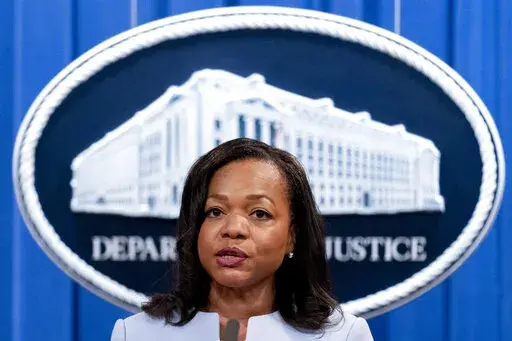 Assistant Attorney General for Civil Rights Kristen Clarke speaks at a news conference at the Department of Justice in Washington, Thursday, Aug. 5, 2021.  The federal government said Thursday, May 12, 2022, that artificial intelligence technology to screen new job candidates or monitor their productivity at work can unfairly discriminate against people with disabilities, sending a warning to employers that the commonly used hiring tools could violate civil rights laws. The U.S. Justice Departme