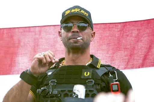 Proud Boys leader Henry "Enrique" Tarrio wears a hat that says The War Boys during a rally in Portland, Ore., Sept. 26, 2020. Tarrio pleaded not guilty on Tuesday, April 5, 2022, to charges that he remotely led a plot to stop Congress’ certification of Joe Biden’s 2020 victory. (AP Photo/Allison Dinner, File)