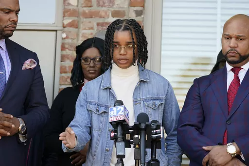 D'Monterrio Gibson speaks Thursday, Feb. 10, 2022, at a news conference in Ridgeland, Miss., about an attack he said happened days earlier while he was delivering packages for FedEx in Brookhaven, Miss. Attorney Carlos Moore, right, filed a civil lawsuit on behalf of Gibson on Nov. 20, 2023, against FedEx and against the two men who are facing criminal charges in the incident. (AP Photo/Rogelio V. Solis, File)