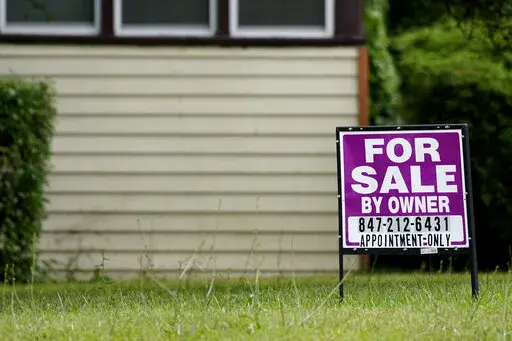 A sign is displayed in front of a home for sale in Prospect Heights, Ill., Thursday, July 10, 2022. Home sale cancellations hit highest rate since start of pandemic by Redfin.  Mortgage buyer Freddie Mac reports on key 30-year mortgage rates on Thursday, Nov. 17. (AP Photo/Nam Y. Huh)