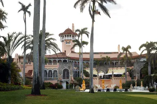 President Donald Trump's Mar-a-Lago estate is seen from the media van in the presidential motorcade in Palm Beach, Fla., March 24, 2018, en route to Trump International Golf Club in West Palm Beach, Fla. Christina Bobb, a lawyer for former president Donald Trump who signed a letter stating that a “diligent search” for classified records had been conducted and that all such documents had been given back to the government has spoken with the FBI, according to a person familiar with the matter.