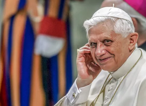 Pope Benedict XVI attends his weekly general audience in the Paul VI Hall at the Vatican, on Wednesday, Aug. 24, 2005. He was the reluctant pope, a shy bookworm who preferred solitary walks in the Alps and Mozart piano concertos to the public glare and majesty of Vatican pageantry. When Cardinal Joseph Ratzinger became Pope Benedict XVI and was thrust into the footsteps of his beloved and charismatic predecessor, he said he felt a guillotine had come down on him. The Vatican announced Saturday D