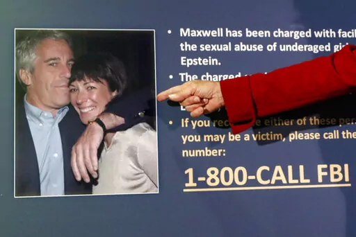 Audrey Strauss, acting U.S. Attorney for the Southern District of New York, points to a photo of Jeffrey Epstein and Ghislaine Maxwell during a news conference, in New York on July 2, 2020. Maxwell says a federal appeals court should reverse her conviction on charges that she joined and enabled the sexual abuse that Epstein committed on scores of teenagers and young women. The arguments her lawyers submitted Tuesday, Feb. 28, 2023, to the 2nd U.S. Circuit Court of Appeals largely repeated claims