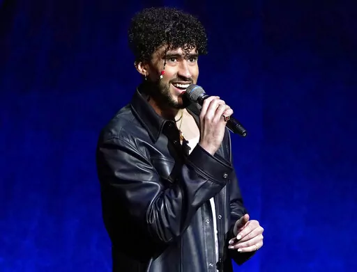 Bad Bunny speaks at the Sony Pictures Entertainment presentation at CinemaCon 2022 in Las Vegas on April 25, 2022. The Puerto Rican superstar was named Artist of the Year, thanks to his latest album, “Un Verano Sin Ti,” becoming Apple Music’s most streamed album of 2022 and the biggest Latin album of all time. (AP Photo/Chris Pizzello, File)