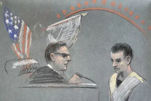 Massachusetts Air National Guardsman Jack Teixeira, right, appears in U.S. District Court in Boston, Friday, April 14, 2023. (Margaret Small via AP)