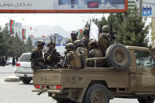 Taliban special force fighters arrive inside the Hamid Karzai International Airport after the U.S. military's withdrawal, in Kabul, Afghanistan, Aug. 31, 2021. A year after America's tumultuous and deadly withdrawal from Afghanistan, assessments of its impact are divided — and largely along partisan lines. (AP Photo/Khwaja Tawfiq Sediqi, File)