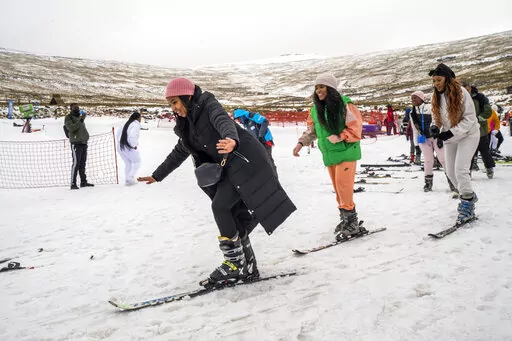 First time skiers take a lesson at the Afriski ski resort near Butha-Buthe, Lesotho, Saturday July 30, 2022. While millions across Europe sweat through a summer of record-breaking heat, Afriski in the Maluti Mountains is Africa's only operating ski resort south of the equator. It draws people from neighboring South Africa and further afield by offering a unique experience to go skiing in southern Africa. (AP Photo/Jerome Delay)