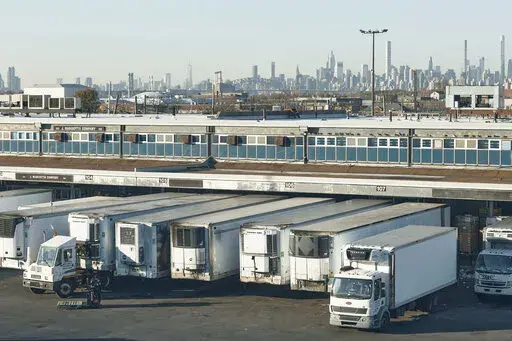Drivers position their trucks on the loading docks inside the Hunts Point Produce Market on Tuesday, Nov. 22, 2022, in the Bronx borough of New York. Hunts Point's wholesalers distribute 2.5 billion pounds of produce a year, with about 30 million pounds having moved on Tuesday alone. The produce ends up at places like Whole Foods, high-end grocers and specialty markets, as well smaller mom-and-pop outlets. Thanksgiving is especially busy time of year because the quintessentially American feast i