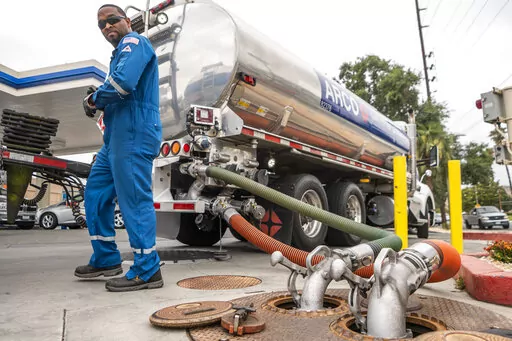 A driver delivers 8,500 gallons of gasoline at an ARCO gas station in Riverside, Calif., Saturday, May 28, 2022. (AP Photo/Damian Dovarganes, File)