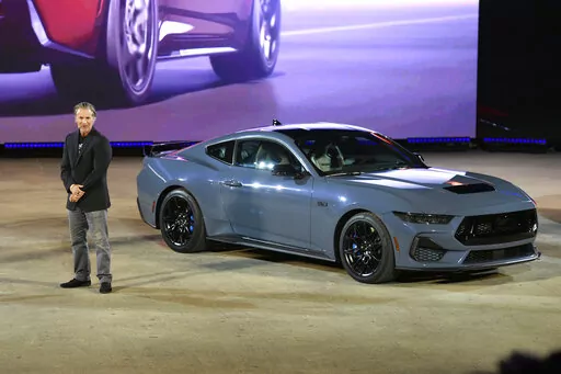 Ed Krenz, Ford Mustang Chief Engineer, talks about one of the models of the 2024 Ford Mustang at the North American International Auto Show, Wednesday, Sept. 14, 2022, in Detroit. (AP Photo/Jose Juarez)