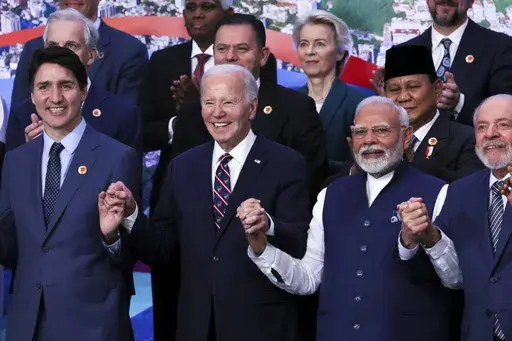 U.S. President Joe Biden, Indian Prime Minister Narendra Modi, Canada's Prime Minister Justin Trudeau and Indian Prime Minister Narendra Modi react, as world leaders gather for a group photo during the G20 summit in Rio de Janeiro, Brazil, Tuesday, Nov. 19, 2024. (Leah Millis via AP, Pool)