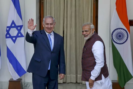 FILE- India's Prime Minister Narendra Modi, right gestures and Israeli Prime Minister Benjamin Netanyahu waves to the media as they arrive for a meeting in New Delhi, India, Jan.15, 2018. Modi, a staunch Hindu nationalist, was one of the first global leaders to swiftly express solidarity with Israel and call the Hamas attack “terrorism.” Modi became the first Indian prime minister to visit Israel in 2017. Netanyahu, travelled to New Delhi the following year and called the relationship betwee