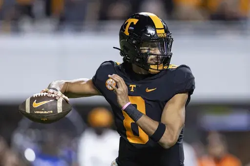 Tennessee quarterback Nico Iamaleava (8) throws to a receiver during the second half of an NCAA college football game against Kentucky, Saturday, Nov. 2, 2024, in Knoxville, Tenn. (AP Photo/Wade Payne)