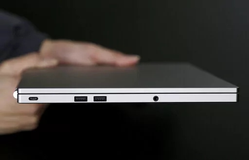 This Tuesday, March 10, 2015 photo shows, from left, the USB Type-C port, two standard USB ports, and headphone jack on a laptop, in San Jose, Calif.  Compared with larger companies, many small businesses have fewer resources to dedicate to cybersecurity, leaving them vulnerable to the ever-evolving tactics of cybercriminals. To protect themselves from cyberthreats, business owners should evaluate their online systems to understand where their data lives and what information needs to be kept saf