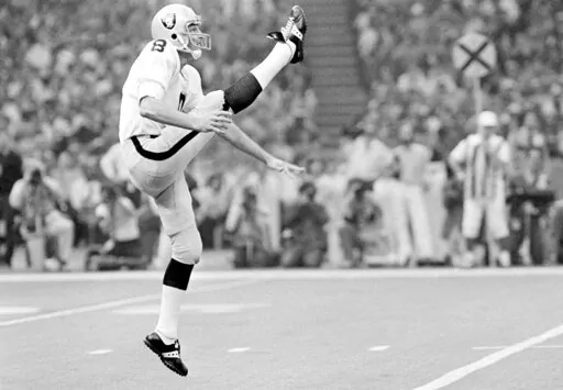 Oakland Raiders punter Ray Guy kicks during the Super Bowl at the Superdome in New Orleans, Jan. 25, 1981. Ray Guy, the first punter to make the Pro Football Hall of Fame, died Thursday, Nov. 3, 2022, following a lengthy illness. He had been receiving care in a Hattiesburg, Miss. area hospice. He was 72. (AP Photo/Richard Drew, File)