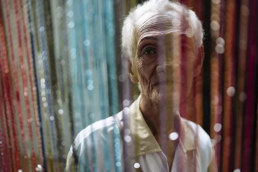 This photo provided by The New York Times shows Al Enriquez, a member of the Golden Gays, is seen in the Home for the Golden Gays, an organisation of elderly gay men in the Philippines who have banded together for social support. On display at the World Press Photo exhibition in Budapest, Hungary in September 2023, this was one of the photos which the government determined was a violation of the law restricting children's access to content that depicts homosexuality or gender change. On Monday, 