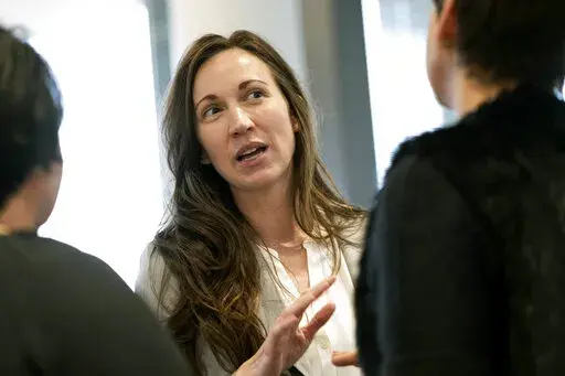 Jennifer Strahan, who is running for Congress in Georgia's 14th district, speaks to people at a Paulding County Chamber of Commerce luncheon in Hiram, Ga., on Thursday, Feb. 3, 2022. Strahan is among the candidates challenging Republican Marjorie Taylor Greene in Georgia's May 24 primary. (AP Photo/Ben Gray)
