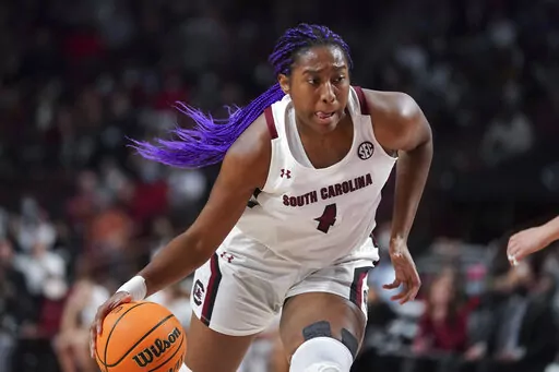 South Carolina forward Aliyah Boston dribbles the ball during the first half of the team's NCAA college basketball game against Stanford on Tuesday, Dec. 21, 2021, in Columbia, S.C. Boston is a unanimous choice to the women's Associated Press preseason All-America team, Tuesday, Oct. 25, 2022. (AP Photo/Sean Rayford, File)