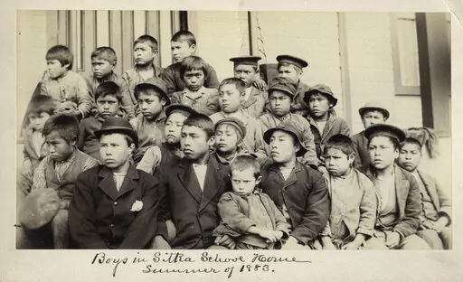This photo made available by the Presbyterian Historical Society, Philadelphia shows students at a Presbyterian boarding school in Sitka, Alaska in the summer of 1883. U.S. Catholic and Protestant denominations operated more than 150 boarding schools between the 19th and 20th centuries. Native American and Alaskan Native children were regularly severed from their tribal families, customs, language and religion and brought to the schools in a push to assimilate and Christianize them. (Presbyteria